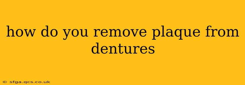 how do you remove plaque from dentures