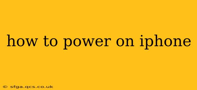 how to power on iphone