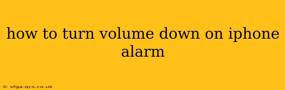 how to turn volume down on iphone alarm
